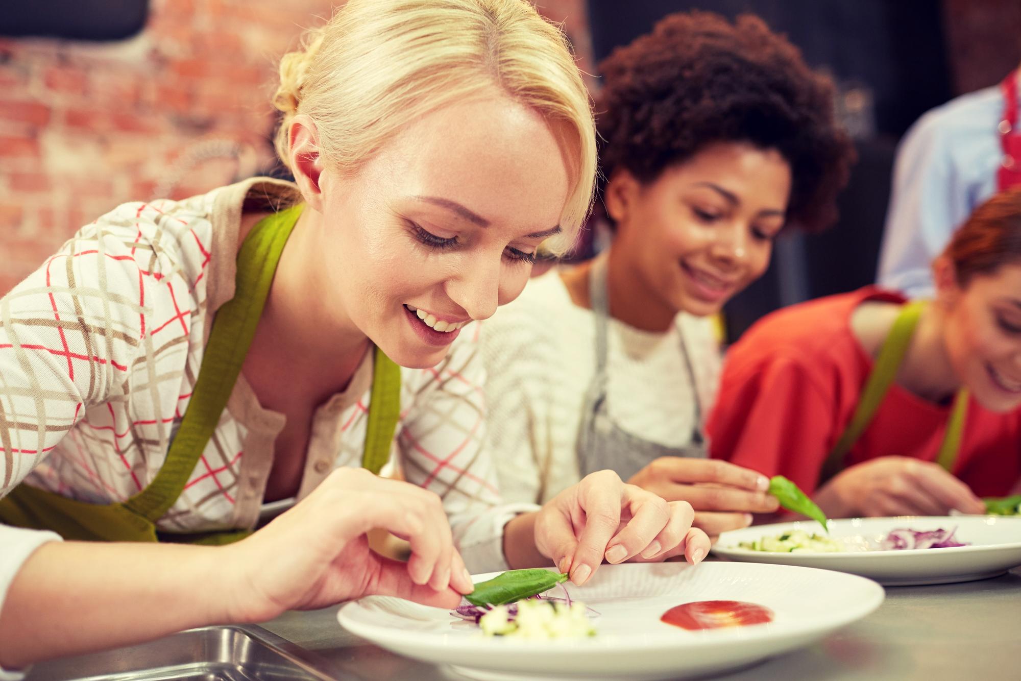 Students plating colorful dish